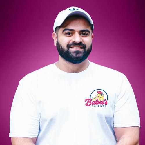 UCR student and Baba’s Chicken business owner, Mahmoud Hemood, smiles for the camera.