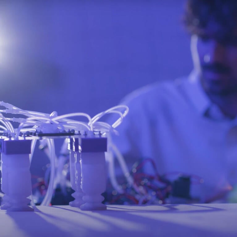 Purple Tinted Image of Student in New Robotics Major