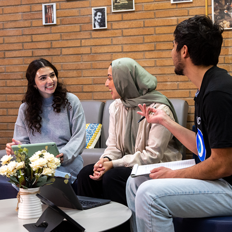 Students chat inside the Middle Eastern Student Center's office on the UC Riverside campus.